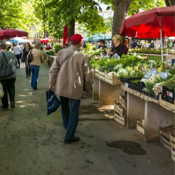 People shopping in outdoor farmers' market